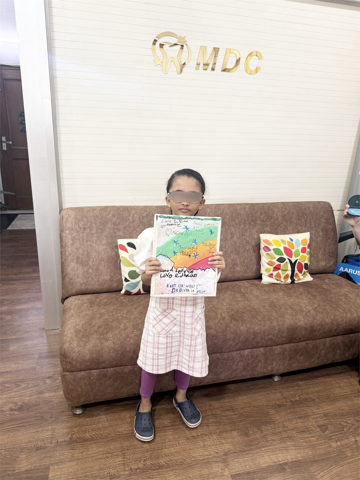 Child in the Marwaha Dental Clinic waiting area in Gurugram