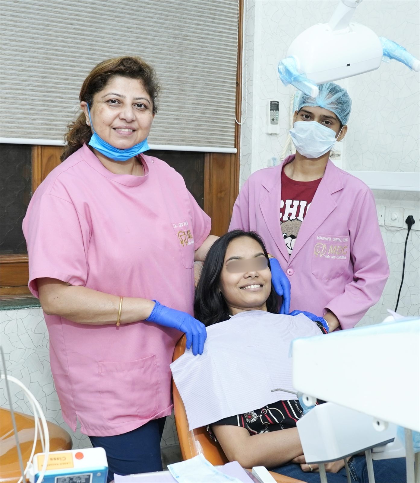 Dr. Divya Marwaha with her dental team and patient at Marwaha Dental Clinic in Gurugram